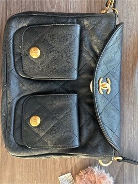 CHANEL Black Quilted Leather Shoulder Bag with Gold Hardware and Front Pockets